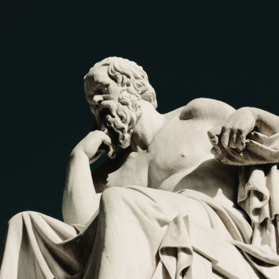 "Marble sculpture of Socrates, one of the historical figures who changed the world - ancient Greek philosopher in contemplative pose with detailed beard and draped toga"