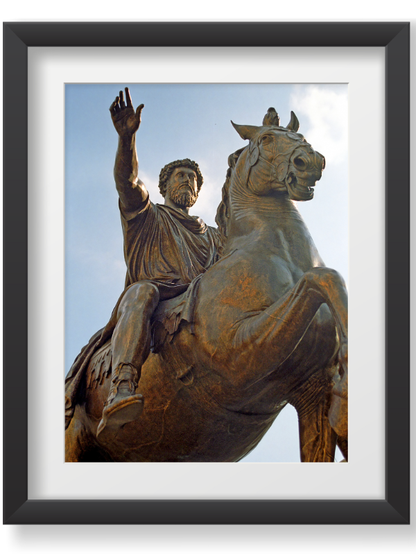A bronze equestrian statue of Roman Emperor Marcus Aurelius, depicting him on horseback with his right arm raised in a gesture of address, set against a light blue sky.