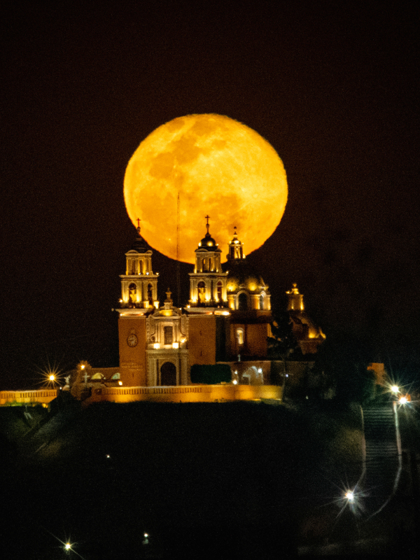The Iglesia de Nuestra Señora de los Remedios, a 16th-century Catholic church atop the Great Pyramid of Cholula in Puebla, Mexico—the largest pyramid by volume.