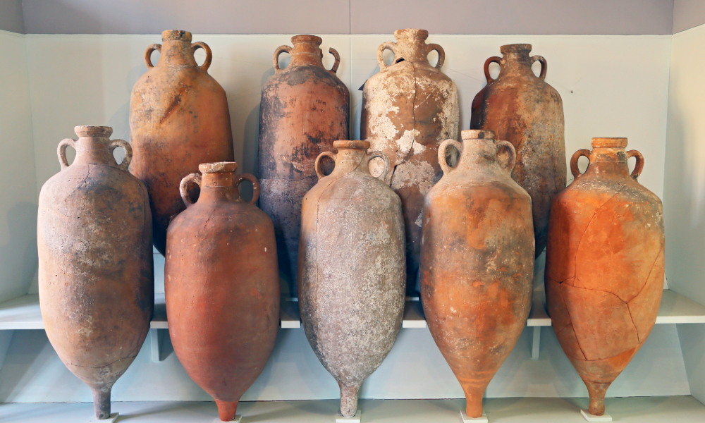 Definition of Amphora: Ancient terracotta amphorae with pointed bases and twin handles