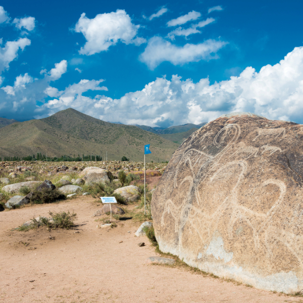 Ancient petroglyphs of animals and hunters at Cholpon-Ata, Kyrgyzstan. Countries that start with K.