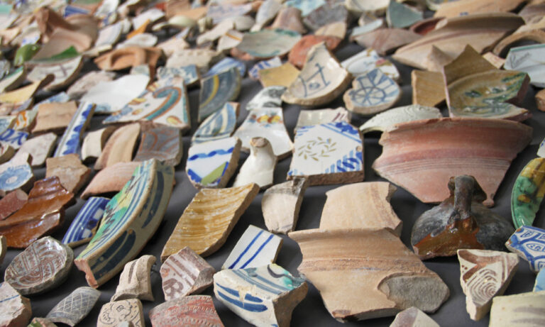 Assorted ancient pottery sherds with varied colors and patterns of ostracon