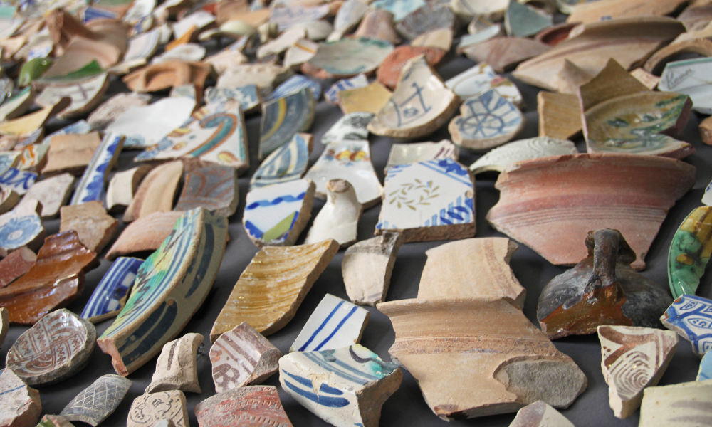Assorted ancient pottery sherds with varied colors and patterns of ostracon