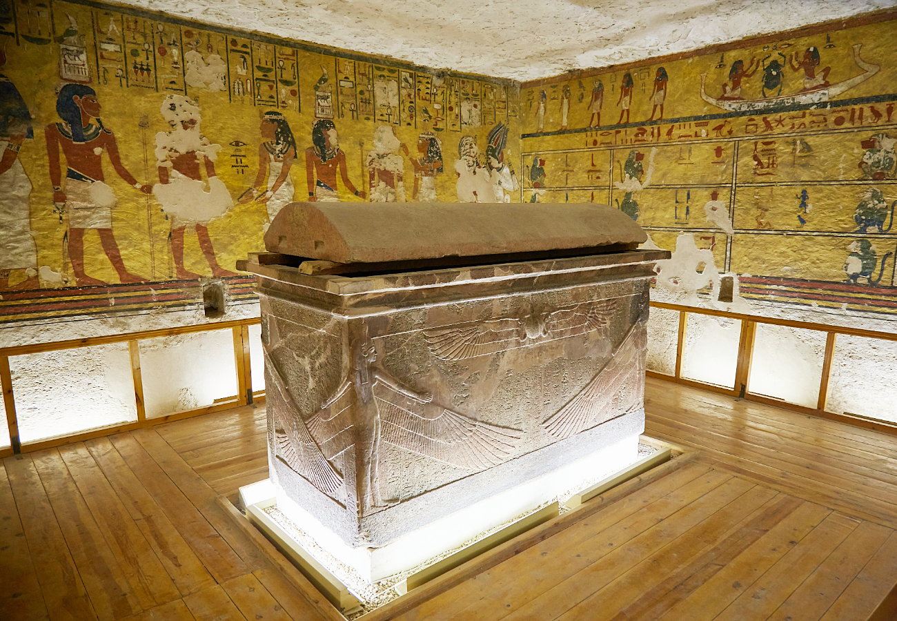 The quartzite sarcophagus from the tomb of Tutankhamun (KV62), featuring winged figures of the goddesses Isis and Nephthys carved in a protective embrace. The sarcophagus housed three coffins containing Tutankhamun’s mummy and remains on display in the tomb, offering insights into royal funerary practices and New Kingdom art. King tut Sarcophagus
