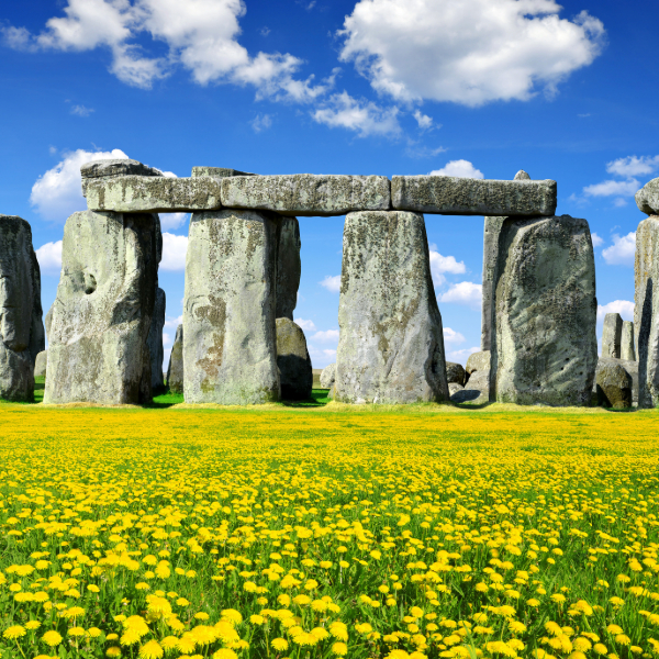 Prehistoric standing stones at Stonehenge on grassy plains. Countries that start with U.