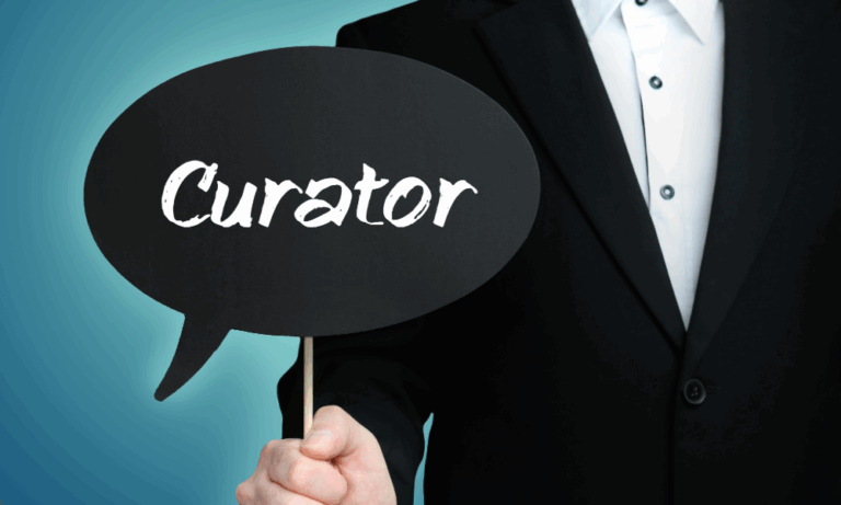 "A professional in a suit holds a large speech bubble prop with 'CURATOR' printed in bold letters, symbolizing the public-facing interpretive role of museum curators against a neutral background."