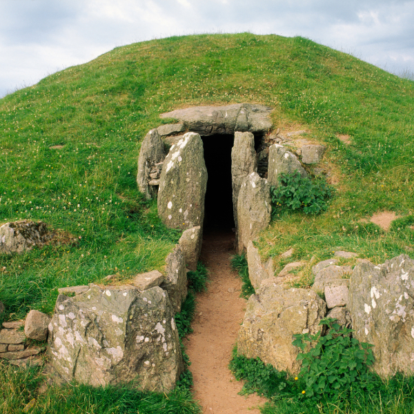 Entrance passage to Bryn Celli Ddu's Neolithic burial chamber. Countries that start with W.