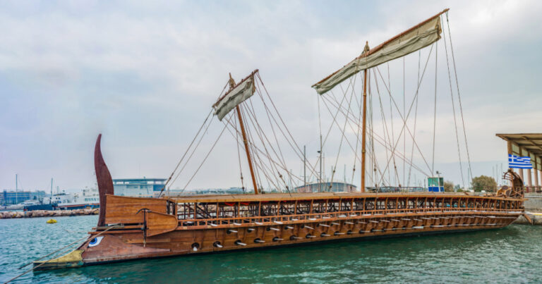 Modern reconstruction of an ancient Greek trireme warship with three rows of oars and bronze ram