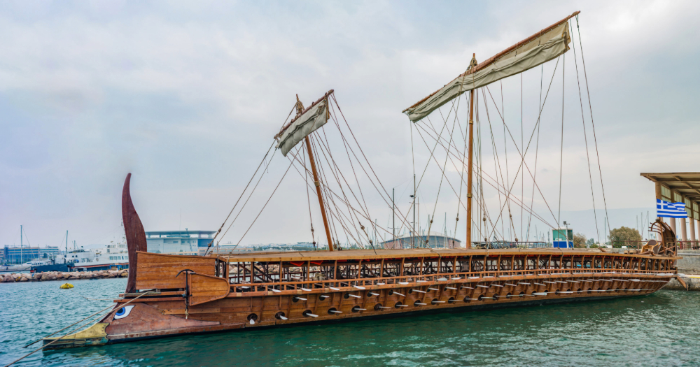 Modern reconstruction of an ancient Greek trireme warship with three rows of oars and bronze ram